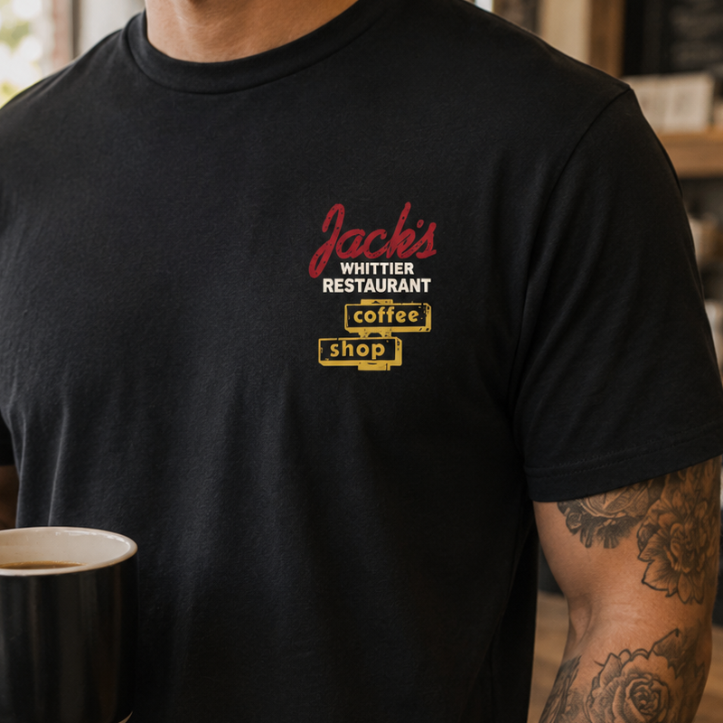 Man holding coffee in a black custom printed Jack's Whittier Restaurant tee
